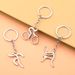 Unisex Creative metal multi-sport logo key chain Bicycle running weightlifting football basketball key chain small gift_maomaolike.com
