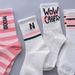 Unisex Socks female long tube ins tide high appearance level Sen department middle tube student white word mother and daughter grow socks female_maomaolike.com