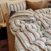 Wholesale INS Style Mixed Retro Striped Milk Velvet Autumn Winter Coral Fleece Warm Flannel Four-Piece Set_maomaolike.com