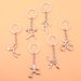 Unisex Creative metal multi-sport logo key chain Bicycle running weightlifting football basketball key chain small gift_maomaolike.com